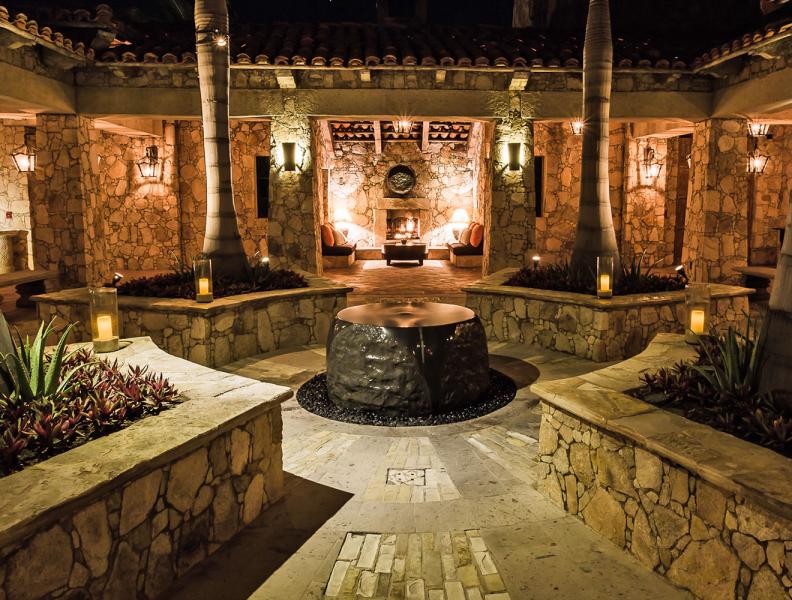 Hotel courtyard with water feature at night