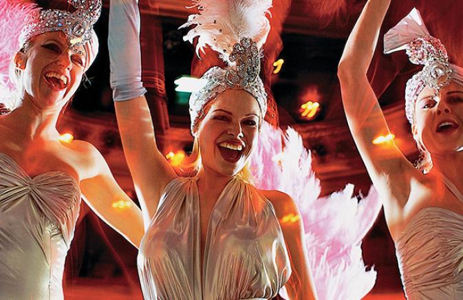 3 women dancing at festival