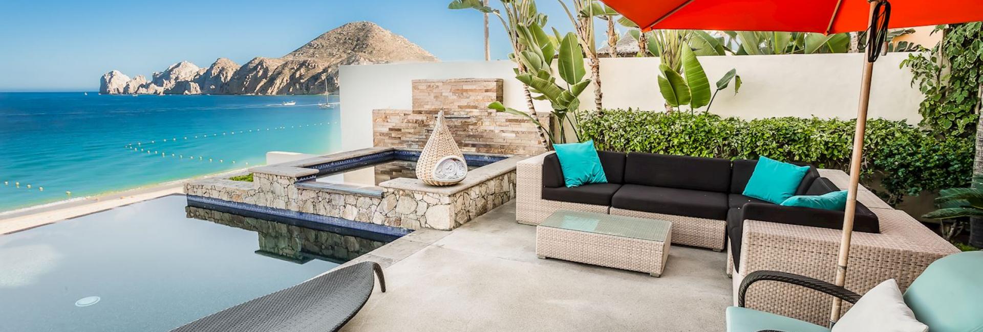 Cabana Chairs and pool overlooking the water